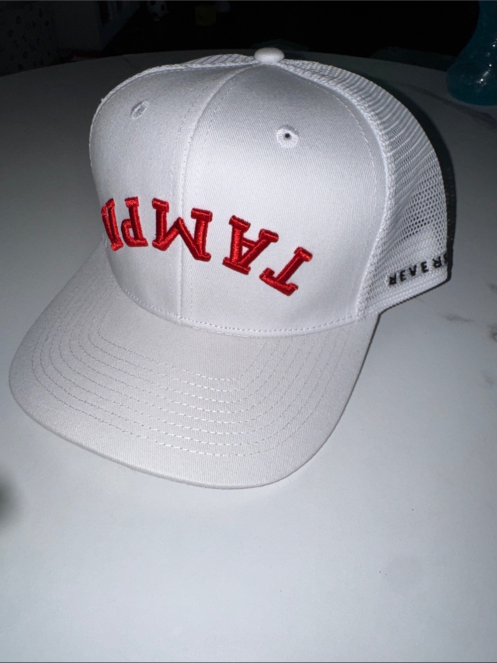 White Trucker Hat with Red Embroidered 'TAMPA’ upside down script